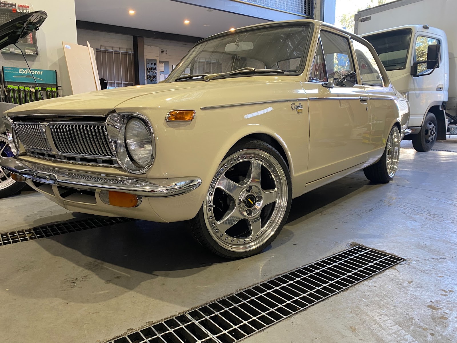 Classic Toyota Corolla being serviced